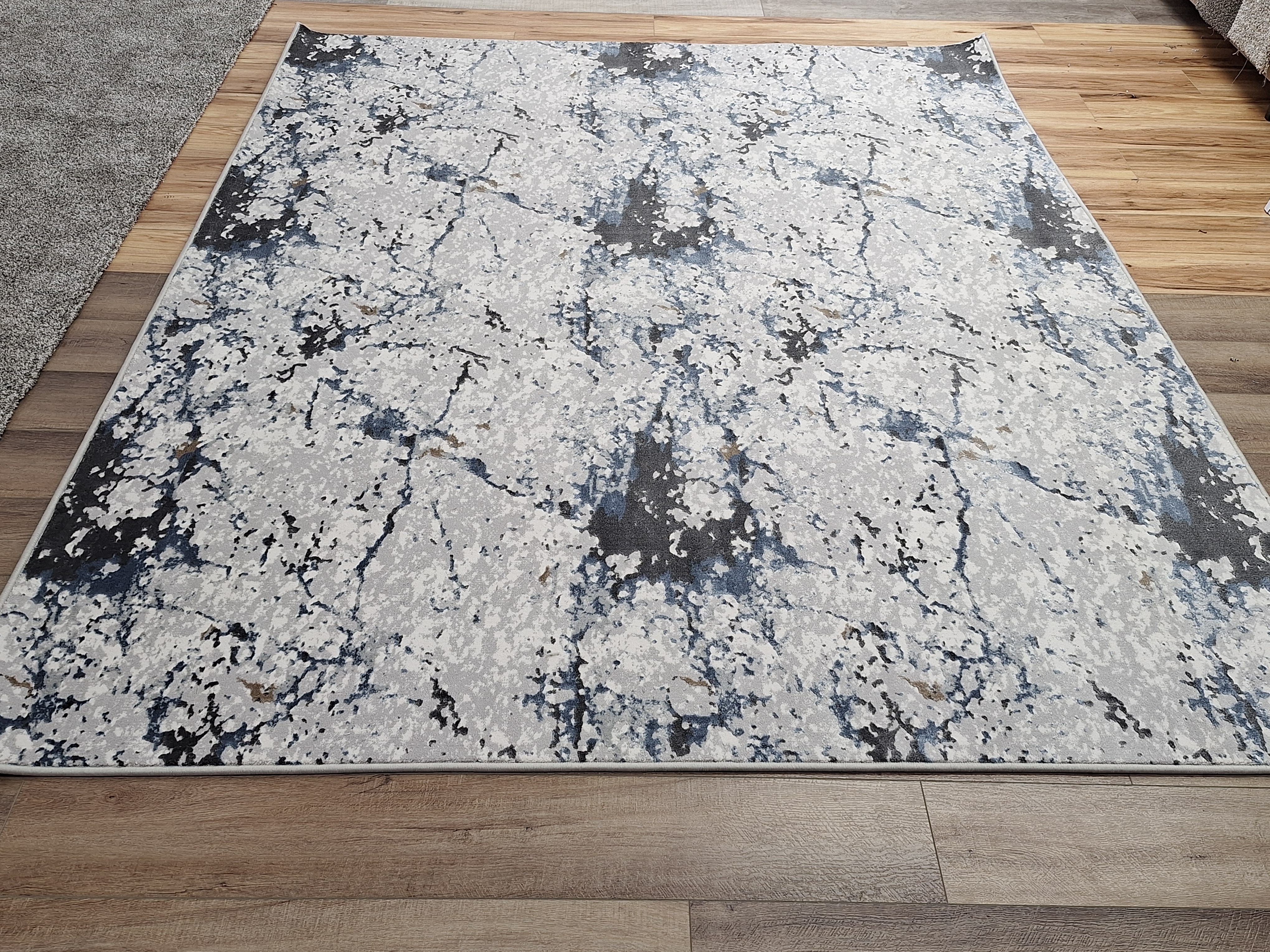 Custom area rug with marble pattern made in-house at James Flooring